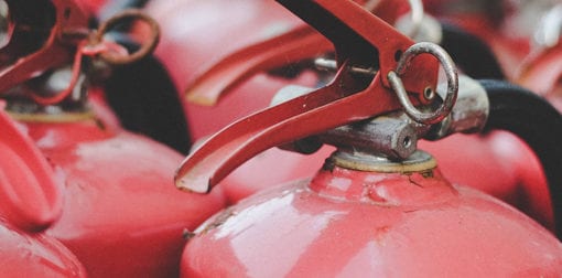 How often should fire extinguishers be serviced?