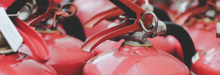 How often should fire extinguishers be serviced?